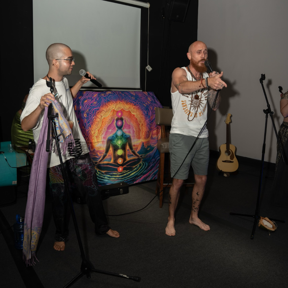 GRMSLY performing live beside one of his paintings